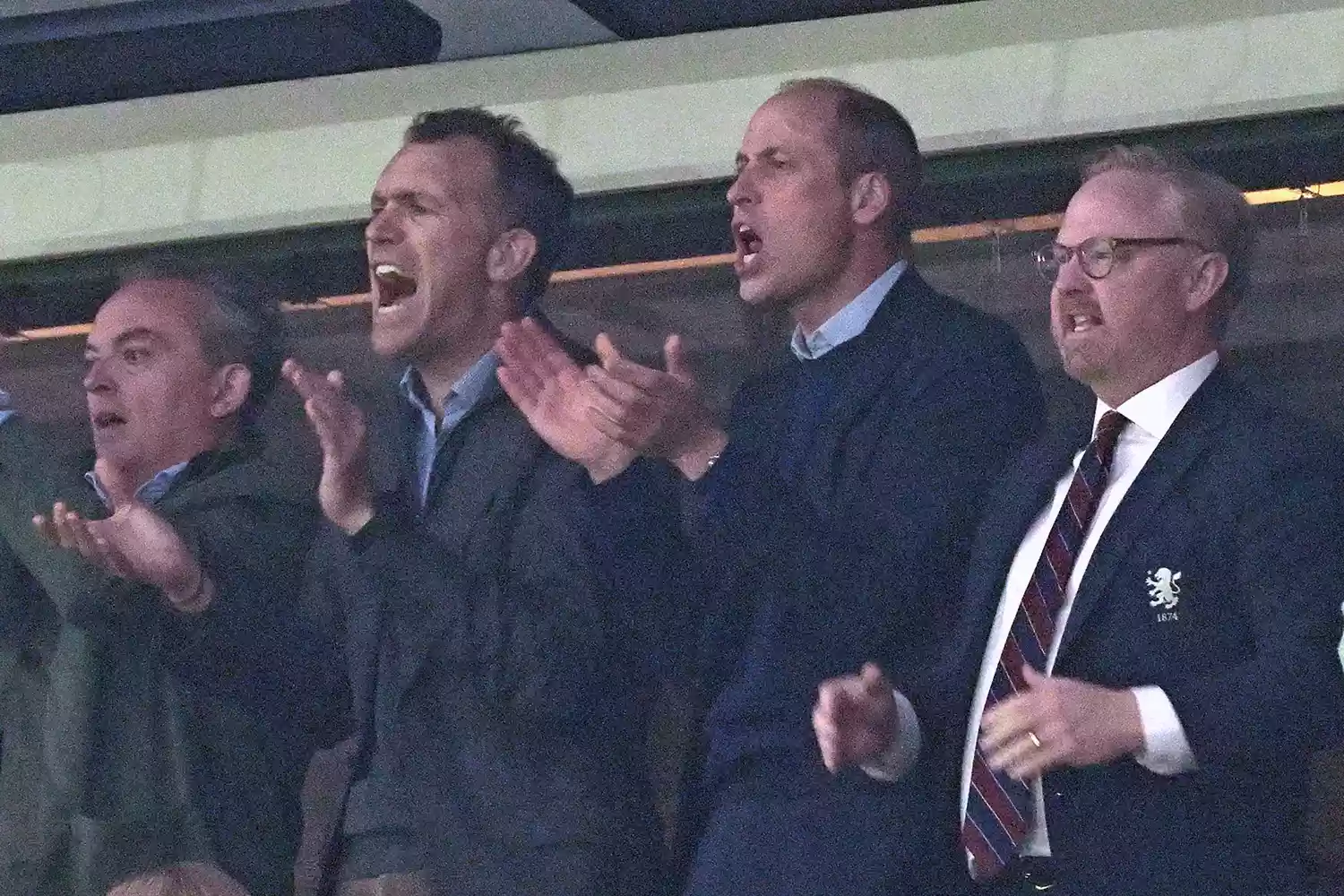 Prince William, Prince of Wales (2R) reacts during the UEFA Europa Conference League semi final first leg football match between Aston Villa and Olympiakos